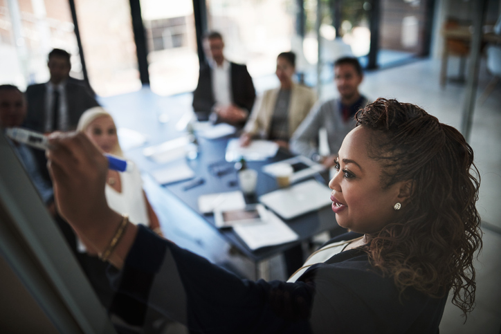 Female board member in a meeting with colleagues 