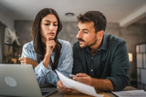 couple boyfriend and girlfriend read together letter from envelope